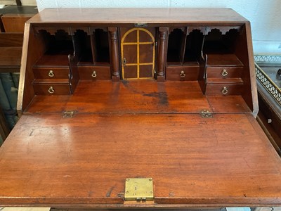 Lot 65 - A 19th century mahogany bureau with fall front...