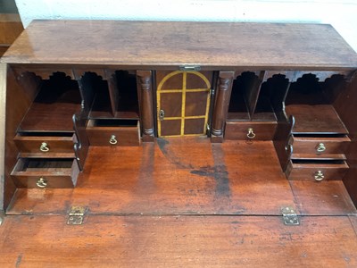 Lot 65 - A 19th century mahogany bureau with fall front...