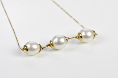 Lot 344 - An 18ct yellow gold fine link chain suspending...