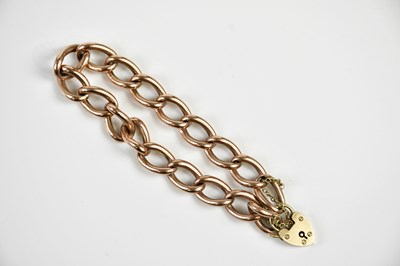 Lot 291 - A 9ct rose gold curb link bracelet with...