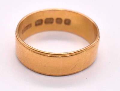 Lot 1207 - A 22ct yellow gold wedding band, size M,...