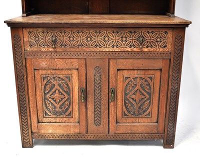 Lot 42 - An early 20th century carved oak dresser with...