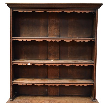 Lot 42 - An early 20th century carved oak dresser with...