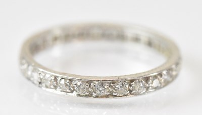 Lot 1430 - A white metal diamond set eternity ring, size...