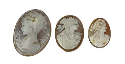 Lot 1489 - A group of three shell cameos depicting ladies,...