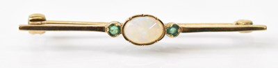 Lot 1498 - A 9ct yellow gold opal and emerald set bar...