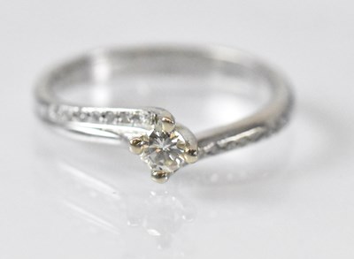 Lot 1445 - A 14ct white gold diamond solitaire ring, the...