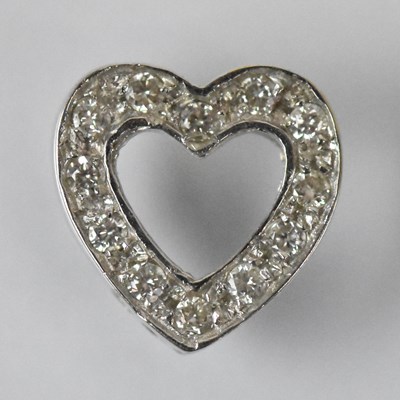 Lot 1525 - A white metal diamond set heart shaped pendant,...