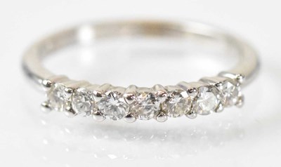 Lot 1429 - An 18ct white gold seven stone diamond ring,...