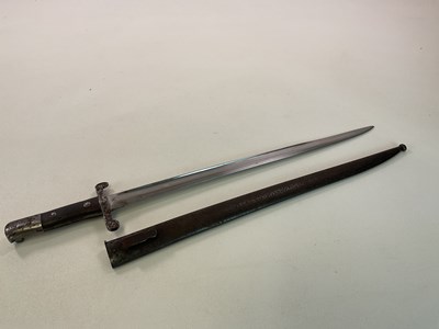 Lot 18 - A British Victorian bayonet with scabbard,...