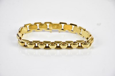 Lot 275 - A yellow metal fancy link bracelet, length...