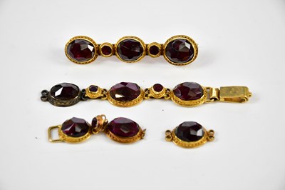 Lot 10 - A foil backed gem set yellow metal bracelet...