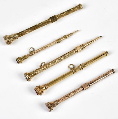 Lot 1335 - Five Victorian yellow metal propelling pencils,...