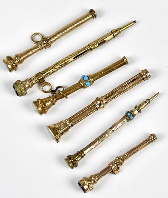 Lot 1329 - Six late Victorian yellow metal propelling...