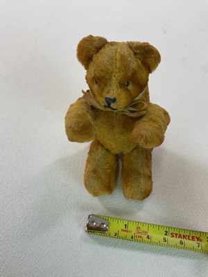 Lot 388 - A miniature jointed teddy bear, in the style...