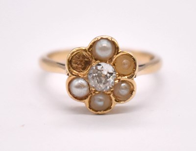Lot 1229 - An 18ct yellow gold flowerhead ring centred...