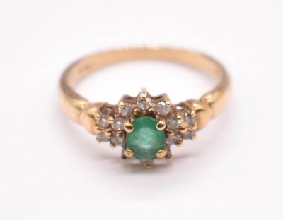 Lot 1225 - A 9ct yellow gold emerald and diamond floral...