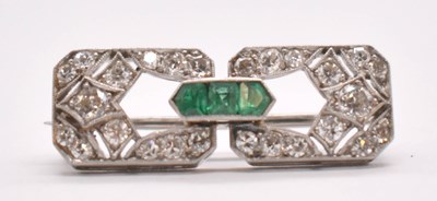 Lot 1226 - An Art Deco white metal emerald and diamond...