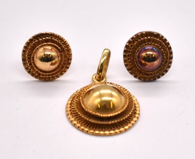 Lot 1227 - An 18ct yellow gold target style circular...