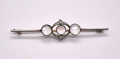 Lot 1220 - An Art Deco white and yellow metal moonstone...