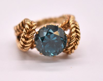 Lot 1222 - A yellow metal dress ring with claw set...