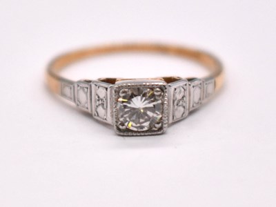 Lot 1210 - An 18ct yellow gold white metal tipped diamond...