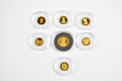 Lot 2563 - Seven proof miniature gold coins including...