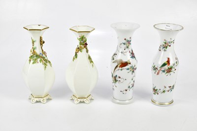 Lot 2636 - A pair of Victorian painted milk glass vases...