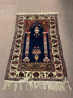 Lot 1216 - An Eastern part silk wall hanging, decorated...