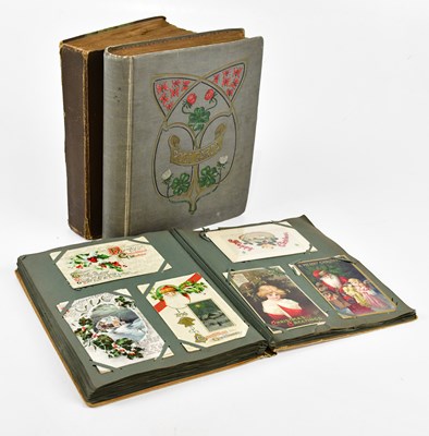 Lot 1735 - Three vintage postcard albums containing...