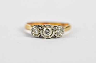 Lot 138 - An 18ct yellow gold illusion set three stone...