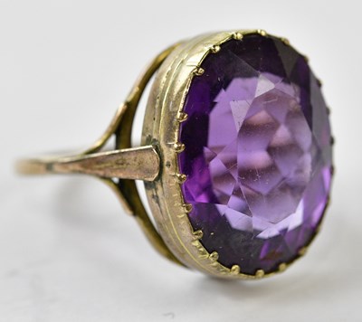 Lot 2416 - A Victorian yellow metal amethyst dress ring,...