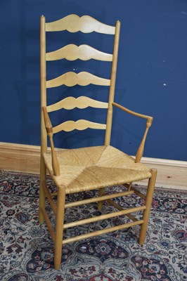 Lot 1153 - LAWRENCE NEAL; a 1980s rush seated ladderback...