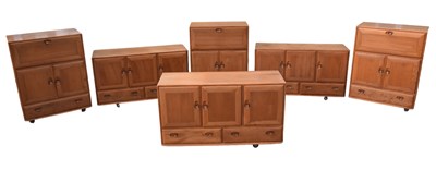 Lot 1146 - ERCOL; a collection of light elm furniture...