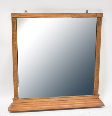 Lot 72 - A wall mirror with partial carved floral frame,...