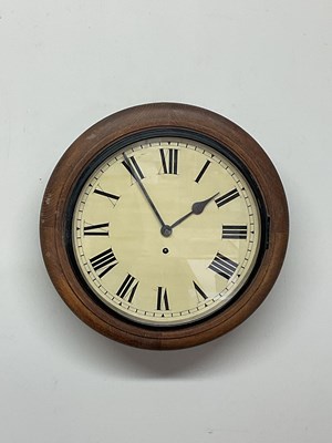 Lot 1355 - An early 20th century circular oak wall clock...
