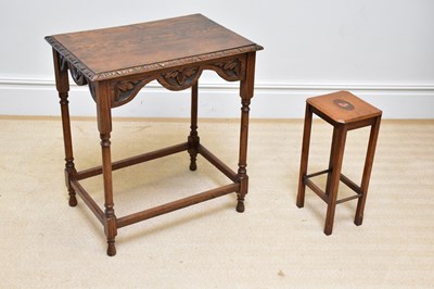 Lot 46 - A 1920s carved oak side table on turned...