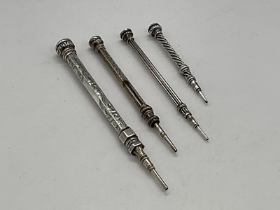 Lot 46 - Four silver propelling pencils.
