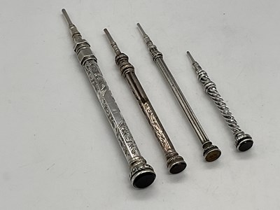 Lot 46 - Four silver propelling pencils.