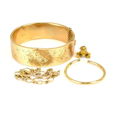 Lot 1019 - A small gold necklace pendant, a single gold...