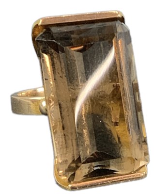Lot 1469 - A yellow metal smoky quartz set ring, size Q,...