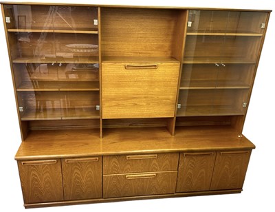Lot 15 - MEREDEW; a mid century teak wall unit, the...