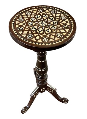 Lot 29 - An Islamic tripod table inlaid with mother of...