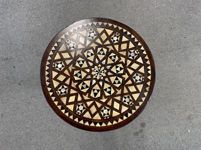 Lot 29 - An Islamic tripod table inlaid with mother of...