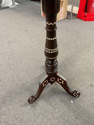 Lot 29 - An Islamic tripod table inlaid with mother of...