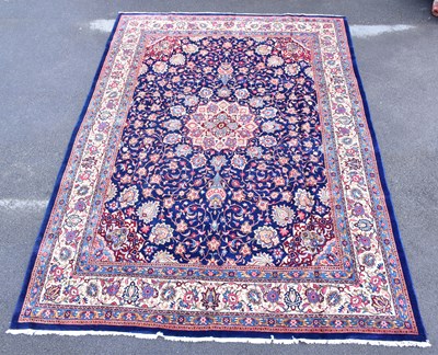Lot 1459 - A blue ground Persian carpet with all over...