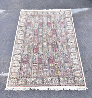 Lot 1460 - A Caucasian beige ground hand woven silk rug...
