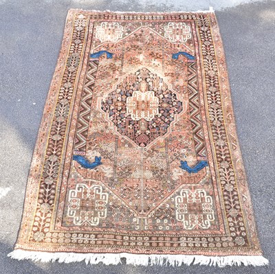 Lot 1469 - A Caucasian hand woven wool rug, with floral...