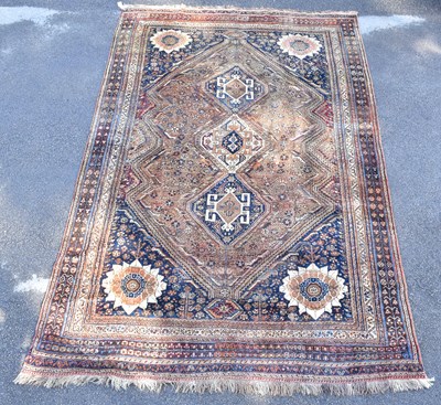 Lot 1468 - A Caucasian hand woven wool rug, with floral...