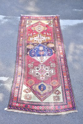 Lot 1485 - A Caucasian hand woven wool runner, with...